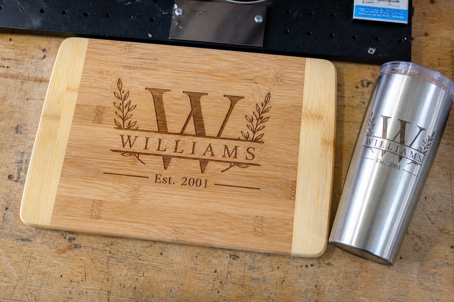 Laser-engraved bamboo cutting board and matching tumbler