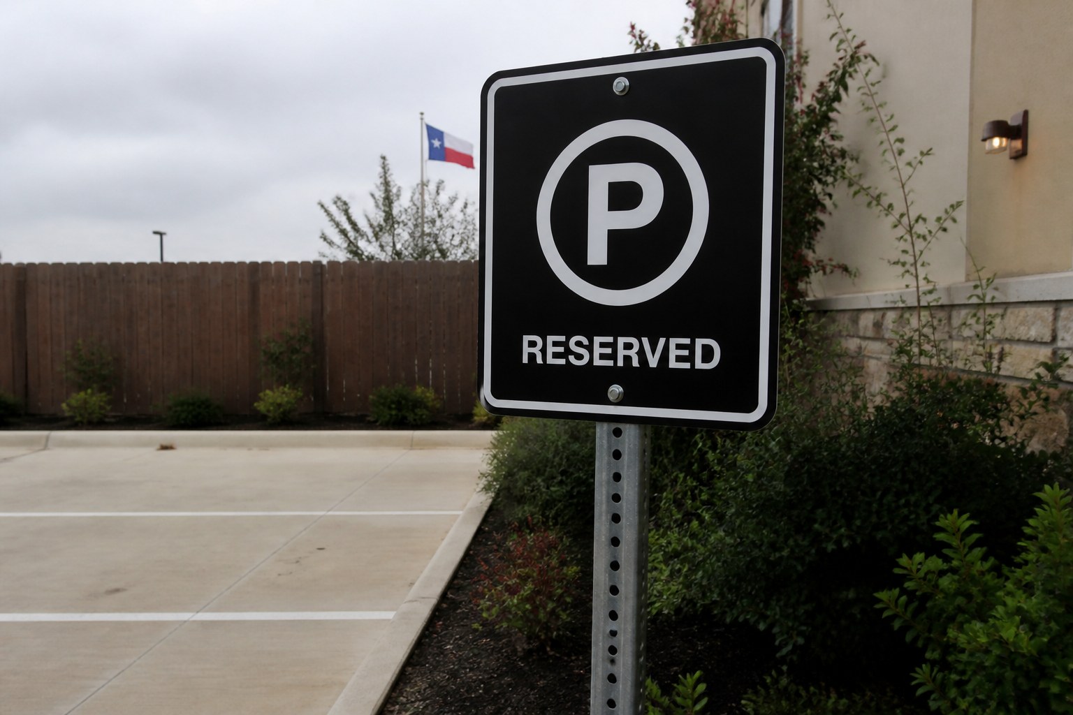 Black Reserved parking sign with a white P
